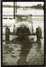 Low-cost, three-wheel economy car (front view).
